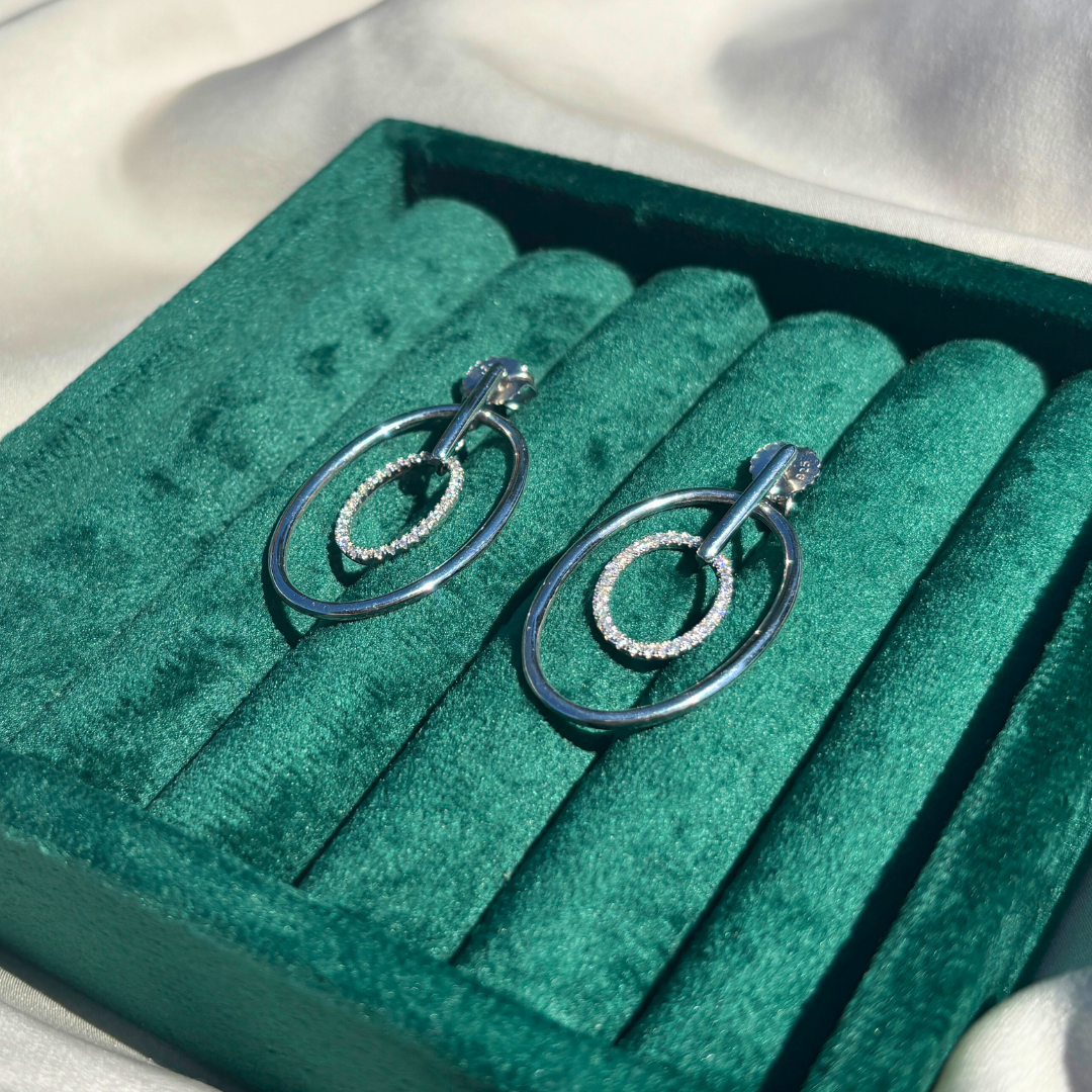 Hand-Crafted Sterling Silver Oval Hoop Earrings with a Centered Cubic Zirconia Band