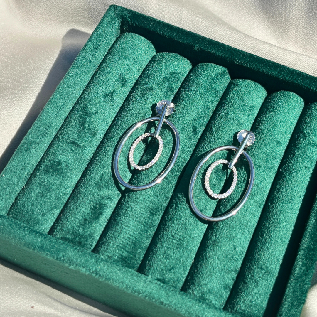 Hand-Crafted Sterling Silver Oval Hoop Earrings with a Centered Cubic Zirconia Band