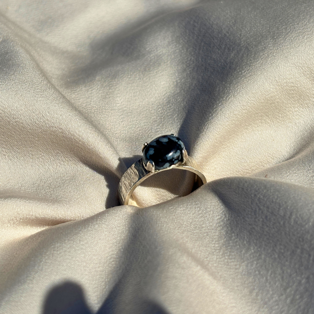 Sterling Silver Ring with a Royal Four-Claw Setting Cradling Deep Lapis Lazuli