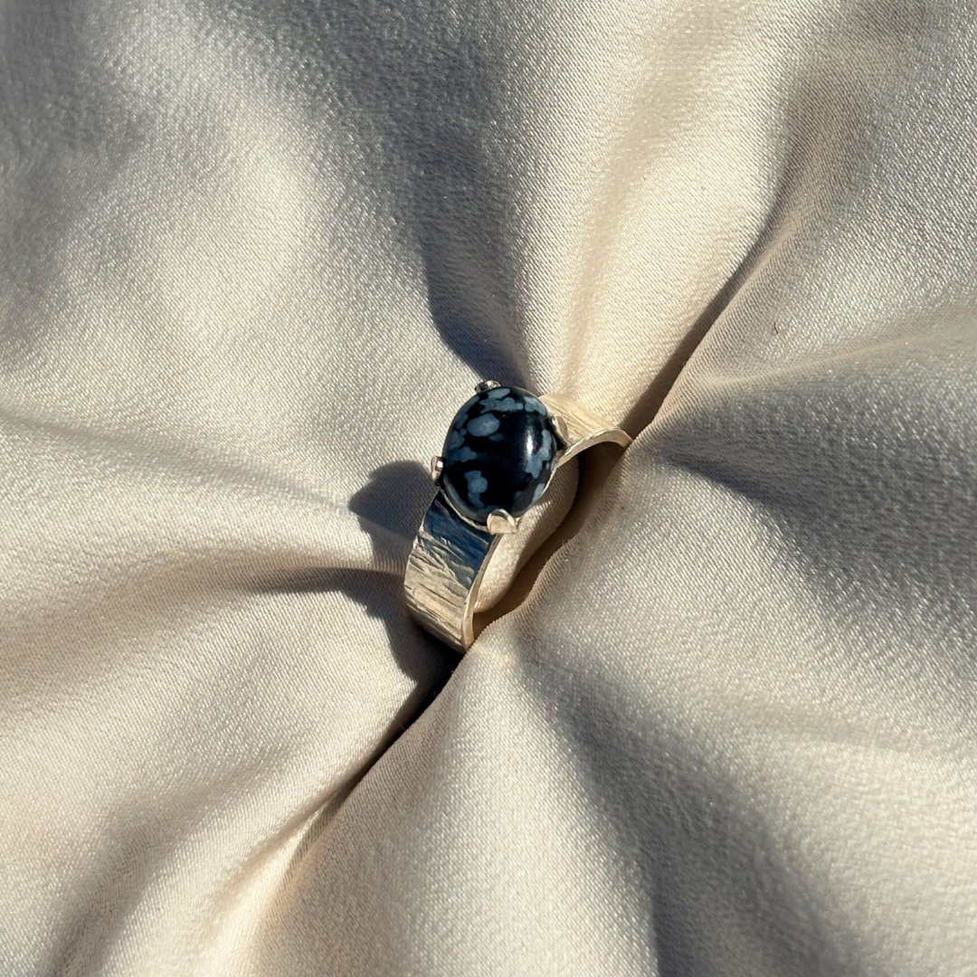 Sterling Silver Ring with a Royal Four-Claw Setting Cradling Deep Lapis Lazuli