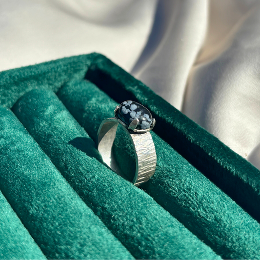 Sterling Silver Ring with a Royal Four-Claw Setting Cradling Deep Lapis Lazuli